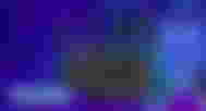 A black Acer router featuring six antenna next to "REVIEW" text in blue with a dark blue glow around it.